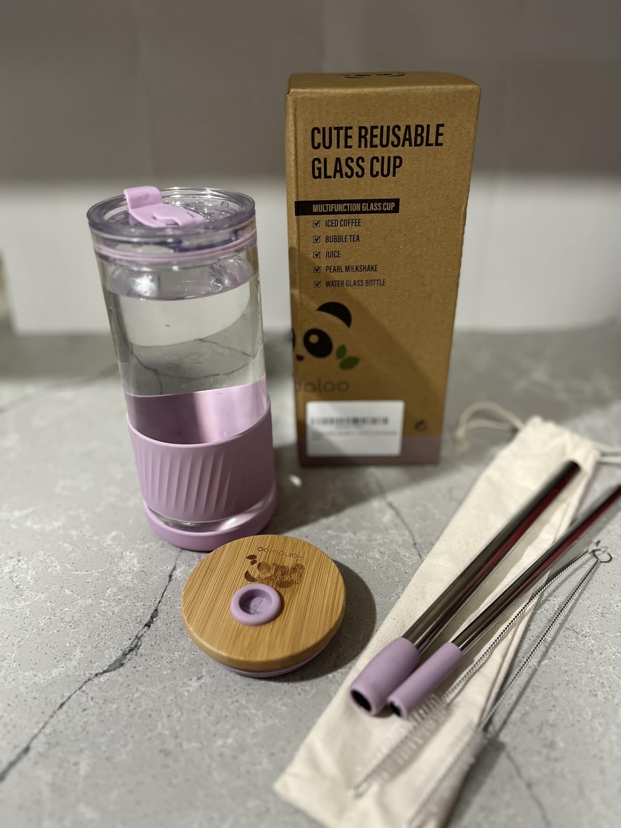 Pandaloo glass cup features including two lids, reusable straws and silicone sleeve