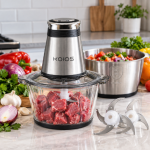 KOIOS 500W food processor with two bowls, stainless steel chopping blades, and fresh ingredients on a kitchen countertop.